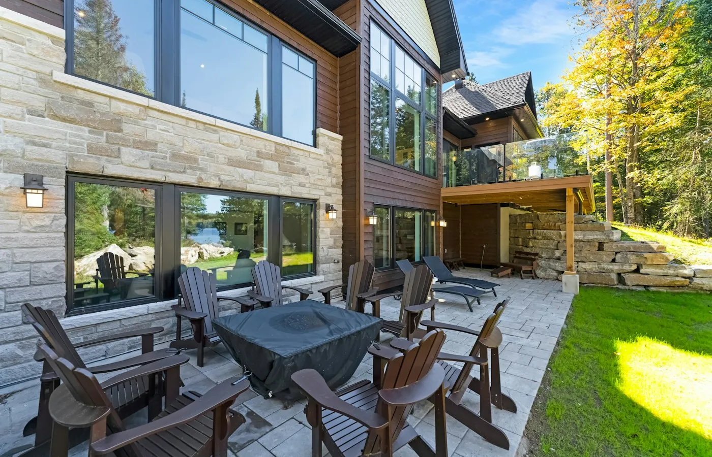 Paver patio with fire pit and stone retaining wall